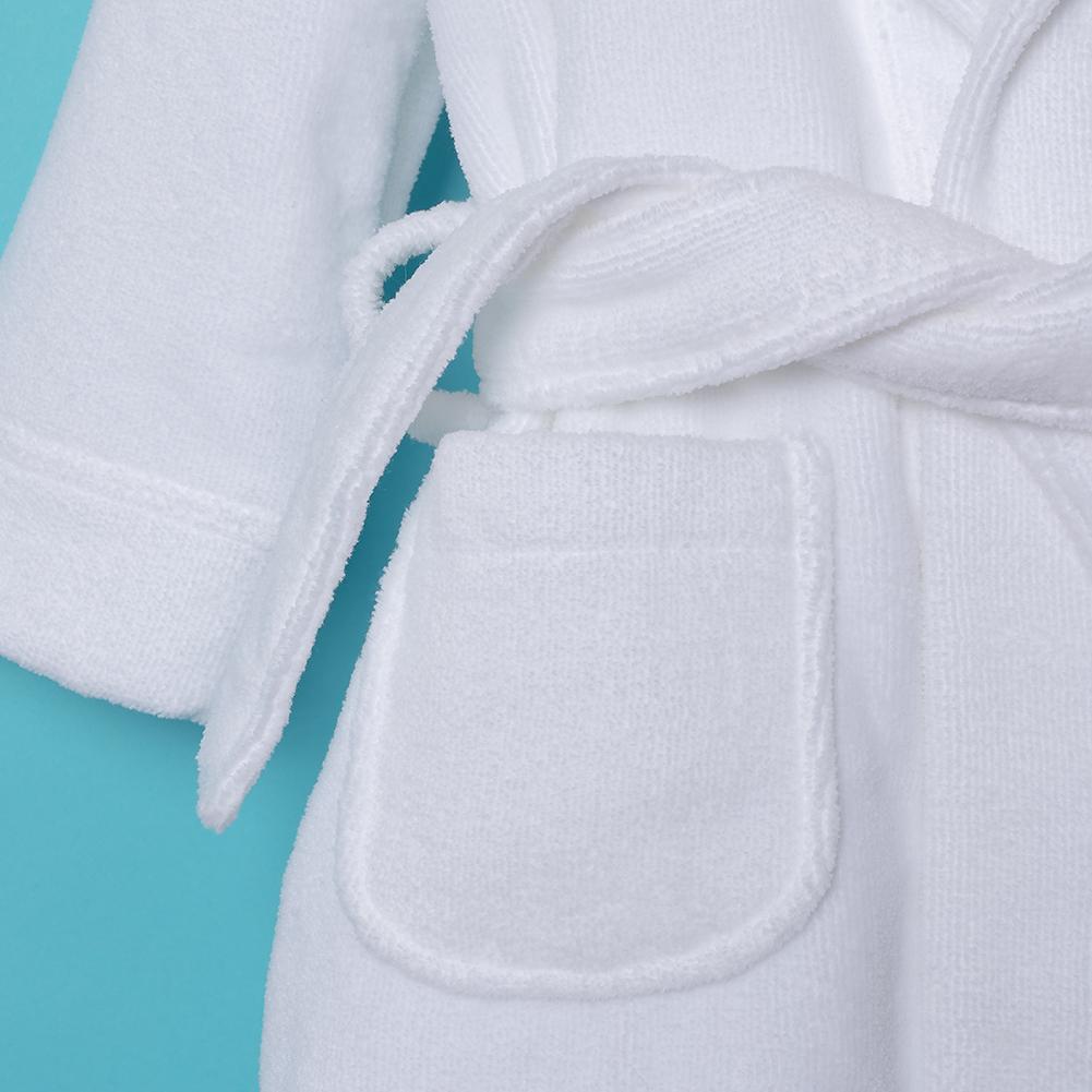 Close-up image of quality of white cotton bathrobe